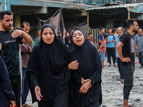 Palestinians mourn the loss of their loved ones at a UN-school housing displacing people that was hit during Israeli bombardment in Nuseirat, in the central Gaza Strip, on June 6, 2024.