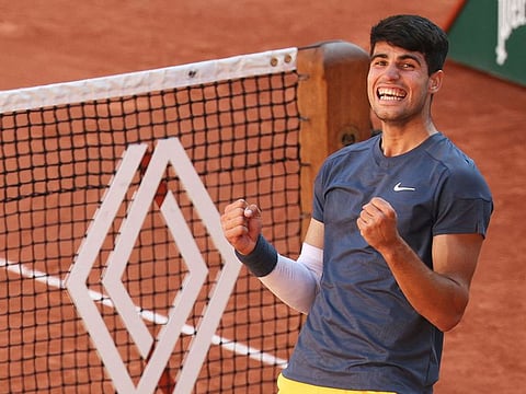 Spain's Carlos Alcaraz celebrates after winning the French Open semi-final against Italy's Jannik Sinner.