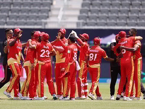 Canada players celebrate after the team's victory during the ICC Men's T20 Cricket World Cup match against Ireland at Nassau County International Cricket Stadium on June 07, 2024 in New York, New York.