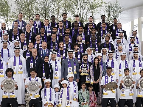 Sheikh Mohamed with the Al Ain Football Club team.