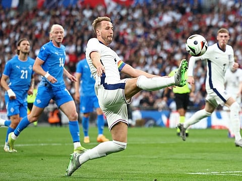 England's striker Harry Kane stretches for the ball during the International friendly football match against Iceland at Wembley Stadium in London on June 7.