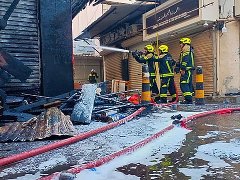The Civil Defence continues its efforts to extinguish the fire in Manama Souq.