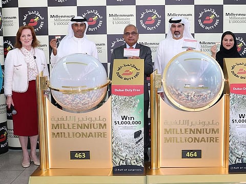 DDF representatives with the winning tickets at the airport on Wednesday