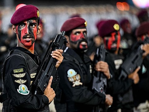Saudi security forces take part in a military parade as pilgrims arrive for the annual Hajj pilgrimage in Mecca on June 10, 2024.