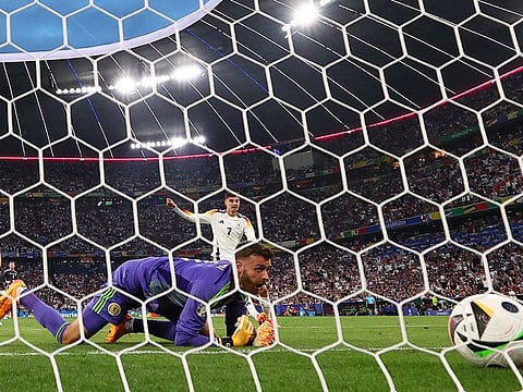 Scotland's Angus Gunn looks dejected after Germany's Florian Wirtz scores their first goal.