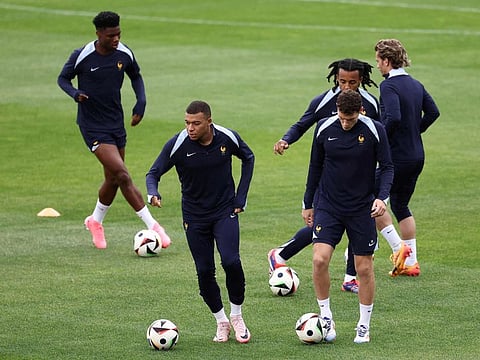 France's forward Kylian Mbappe (left) and defender Benjamin Pavard take part in an MD-1 training session at Paul Janes Stadium in Duesseldorf on Sunday.