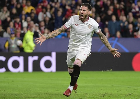 Sevilla's Spanish defender Sergio Ramos celebrates scoring the opening goal during the Uefa Champions League first round group B football match against PSV Eindhoven at the Ramon Sanchez Pizjuan stadium in Seville on November 29, 2023.