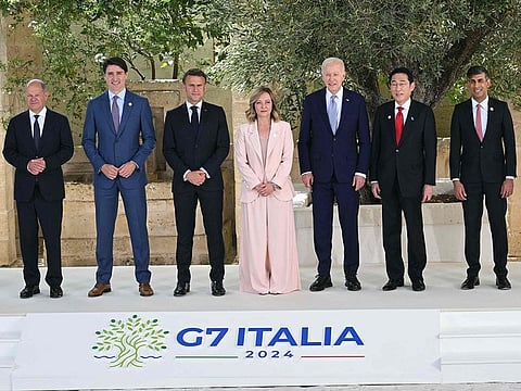 From left: German Chancellor Olaf Scholz, Canadian Prime Minister Justin Trudeau, French President Emmanuel Macron, Italy's Prime Minister Giorgia Meloni, US President Joe Biden, Japanese Prime Minister Fumio Kishida, British Prime Minister Rishi Sunak pose for a family photo at Borgo Egnazia resort during the G7 Summit hosted by Italy in Apulia region, on June 13, 2024 in Savelletri.