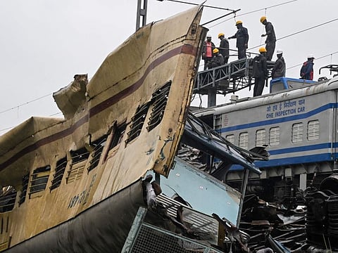 Indian Railway engineers inspect the accident site of Kanchenjunga Express passenger train at Rangapani in India's West Bengal state on June 18, 2024.