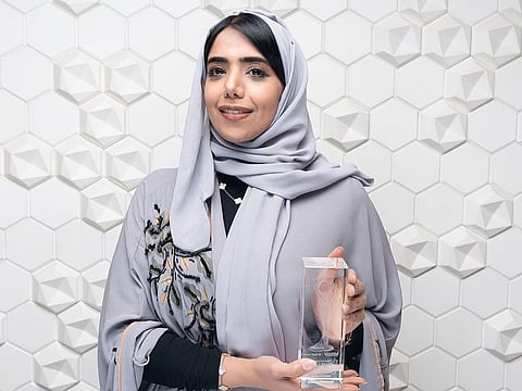 Khaloud Alhammadi with her Excellence in Corporate – Best in Treasury Management award