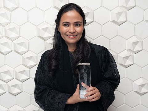 Abigail Zatarain with her Excellence in Human Resources – Best in Emiratisation award