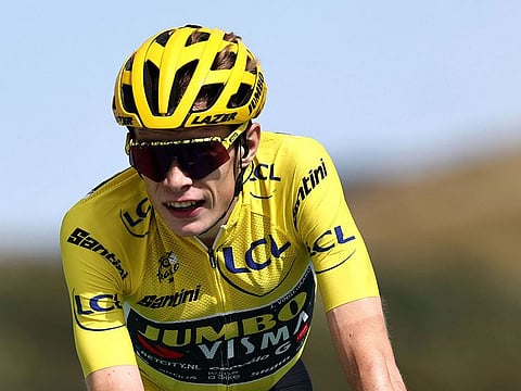Jumbo-Visma's Danish rider Jonas Vingegaard wearing the overall leader's yellow jersey crosses the finish line at the end of the 20th stage of the 110th edition of the Tour de France last July.