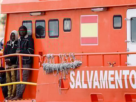 A migrant waits to disembark from a Spanish coast guard vessel at the port of Arguineguin, on the island of Gran Canaria, Spain, June 6, 2024. Spain is one of the main gateways for migrants seeking a better life in Europe, with the vast majority making the perilous journey to try and reach the Canary Islands which lie off the northwestern coast of Africa.