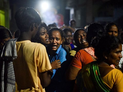 Family members mourn the death of people who died after consuming toxic liquor at Kallakurichi, in Tamil Nadu, India, June 20, 2024.