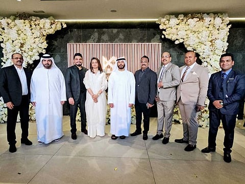 Marwan Bin Ghalita, Director-General of Dubai Land Department, with Navas Khan, Chairman of Marquis Developers, and Mezuk Mohamad, Managing Director of Marquis Developers with their team.