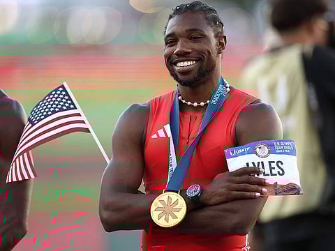 Noah Lyles poses with the flag and the gold medal after winning the men's 100 meter final on Day Three 2024 U.S. Olympic Team Trials Track & Field at Hayward Field on June 23, 2024 in Eugene, Oregon.