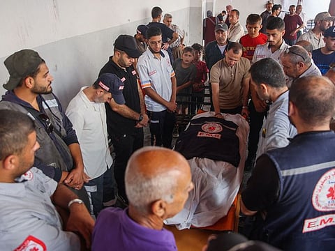 Relatives and medics mourn Hani Al Jaafarawi in Gaza City.