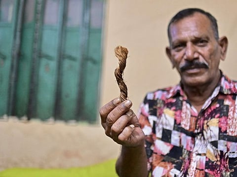 In this photo taken on October 19, 2023, hangman Shahjahan Bouya shows a snip of manila rope used for hanging condemned prisoners, during an interview with AFP at his house in Keraniganj, a Dhaka suburb.