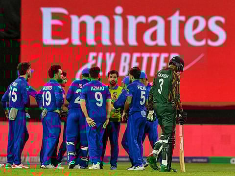 Afghanistan players celebrate the dismissal of Bangladesh vice-captain Taskin Ahmed during their final Super Eight clash on Saturday.