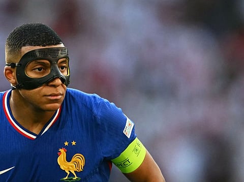 France forward Kylian Mbappe, wearing a protective mask, scored his 13th goal for France at a major tournament, putting him level with Just Fontaine.