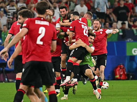 Georgia's players celebrate after winning the Uefa Euro 2024 Group F match against Portugal in Gelsenkirchen on Wednesday.