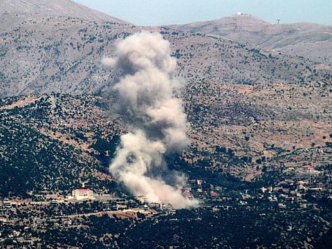 A smoke plume billows during Israeli bombardment on the village of Kfarshuba in south Lebanon near the border with Israel on June 26, 2024 amid ongoing cross-border tensions as fighting continues between Israel and Hamas in the Gaza Strip.