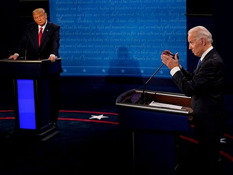 Joe Biden answers a question as Trump listens during the second and final presidential debate at the Curb Event Center at Belmont University in Nashville, Tennessee, on October 22, 2020.