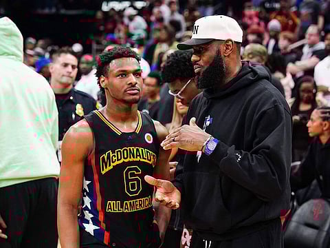 Bronny James of the West team talks to Lebron James of the Los Angeles Lakers after the 2023 McDonald's High School Boys All-American Game at Toyota Center on March 28, 2023 in Houston, Texas.