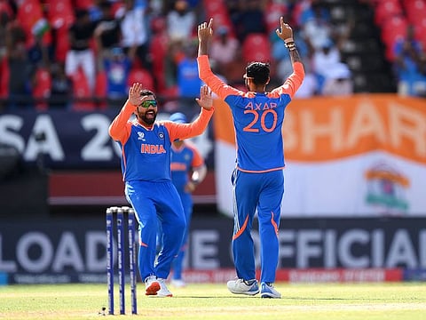 India's Axar Patel and Rohit Sharma.