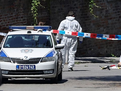 Police officers guard the area after an attack, near the Israeli embassy in Belgrade, Serbia.