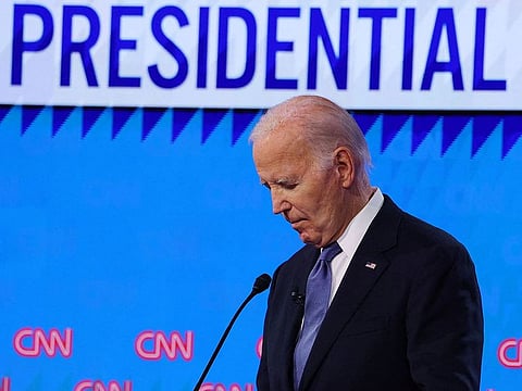 Democrat presidential candidate US President Joe Biden listens as Republican presidential candidate and former U.S. President Donald Trump speaks during their debate in Atlanta, Georgia, U.S., June 27, 2024.