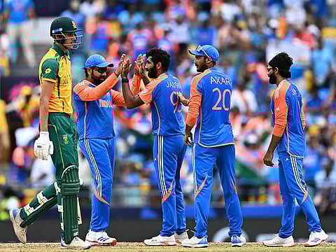 Jasprit Bumrah celebrates with teammates after dismissing Marco Jansen in the final on Saturday.