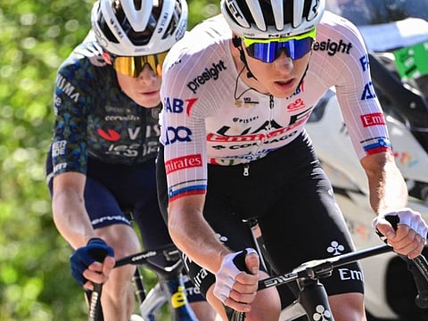 UAE Team Emirates team's Tadej Pogacar (right) and Jonas Vingegaard cycle up the San Luca ascent near Bologna during the second stage of Tour de France.