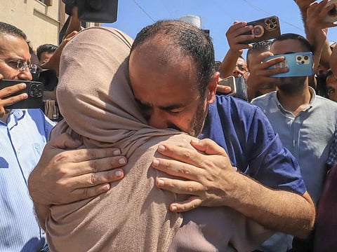 Al Shifa hospital director Mohammed Abu Salmiya is welcomed by relatives after his release alongside other detainees, at Nasser hosPital in Khan Younis in the southern Gaza Strip on July 1, 2024.