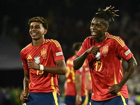 Spain's midfielder Nico Williams (right) celebrates scoring his team's third goal with his teammate Lamine Yamal during the Uefa Euro 2024 round of 16 football match at the Cologne Stadium in Cologne on Sunday.