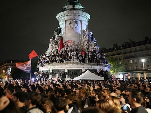 Demonstrators take part in a rally against far right after the announcement of the results of the first round of parliamentary elections, at Place de la Republique in Paris on June 30, 2024.