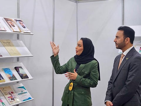 Abdulla Saif Al Nuaimi, Ambassador of the UAE to the Republic of Korea, and Khoula Al Mujaini, Director of Events and Marketing at SBA, during the Ambassador's visit to the Sharjah Book Authority's stand at the book fair in Seoul