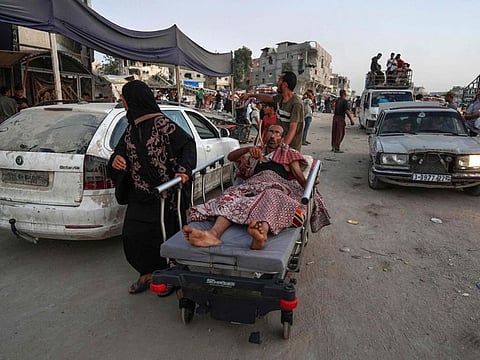 Displaced Palestinians leave an area in east Khan Younis after the Israeli army issued a new evacuation order for parts of the city and Rafah, in the southern Gaza Strip on July 1, 2024.