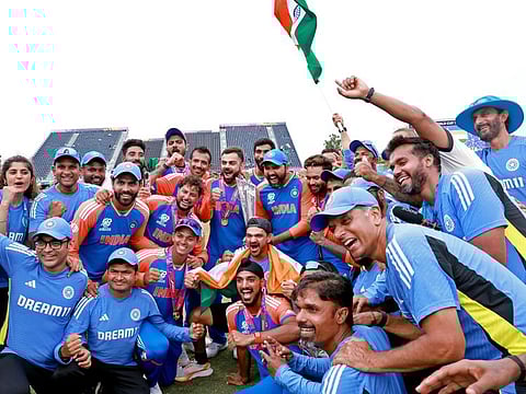 India team members pose with the trophy as they celebrate the team's victory in the ICC Mens T20 World Cup 2024, at Kensington Oval in Barbados recently.