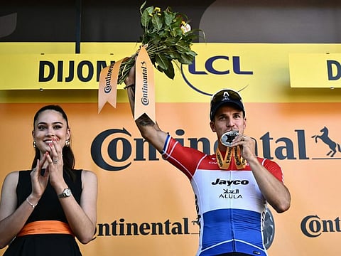 Team Jayco AlUla team's Dutch rider Dylan Groenewegen celebrates on the podium after winning the 6th stage of the 111th edition of the Tour de France cycling race, 163,5 km between Macon and Dijon, on Thursday.