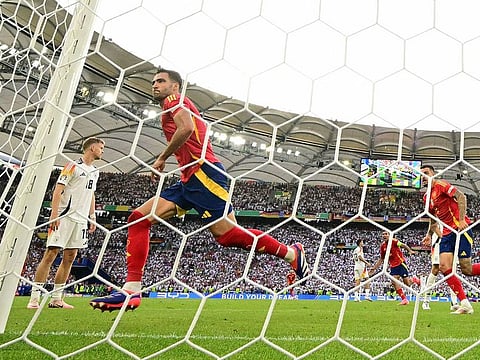 Spain's midfielder Mikel Merino celebrates after scoring the 2-1 goal during the UEFA Euro 2024 quarter-final football match between Spain and Germany.