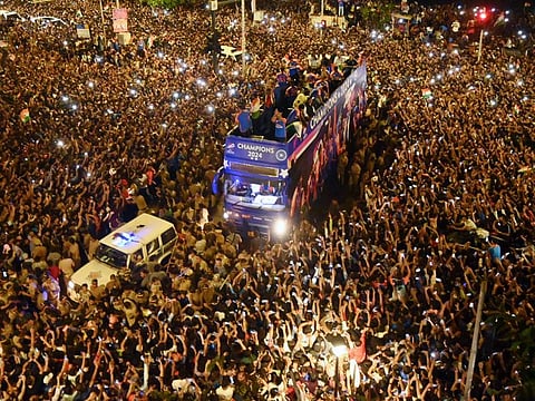 Team India conducts its victory parade and celebrates with a huge crowd of fans as they head to Wankhede Stadium in Mumbai on Thursday.