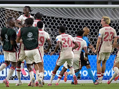 Canada's players celebrate their victory after a penalty shoot-out against Venezuela in the quarter-finals of the Copa America on Friday.