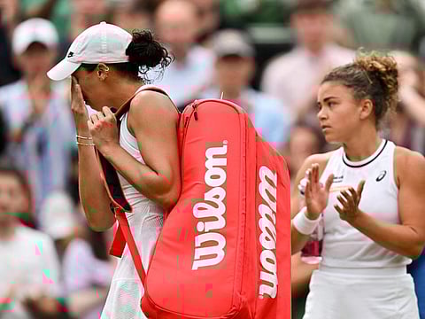 US player Madison Keys (left) cries as she leaves Centre Court after retiring from her women's singles tennis match against Italy's Jasmine Paolini following a thigh injury at The All England Lawn Tennis and Croquet Club in Wimbledon on Sunday.