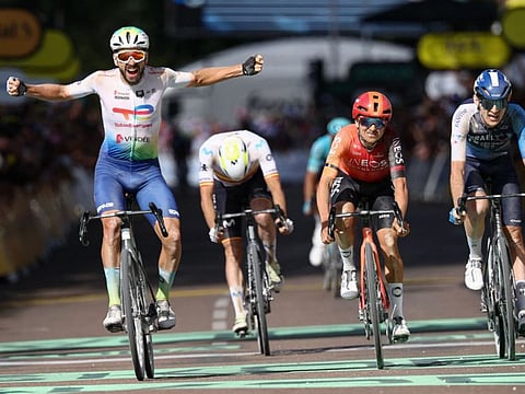 TotalEnergies team's French rider Anthony Turgis cycles to the finish line to win ahead of second-placed INEOS Grenadiers team's British rider Tom Pidcock (C) and third-placed Israel - Premier Tech team's Canadian rider Derek Gee (R) during the 9th stage of the 111th edition of the Tour de France cycling race on Sunday.