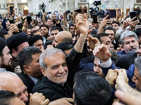 Iran's newly-elected President Masoud Pezeshkian with his supporters as he visits the shrine of the Islamic Republic's founder Ayatollah Ruhollah Khomeini in Tehran on July 6, 2024.
