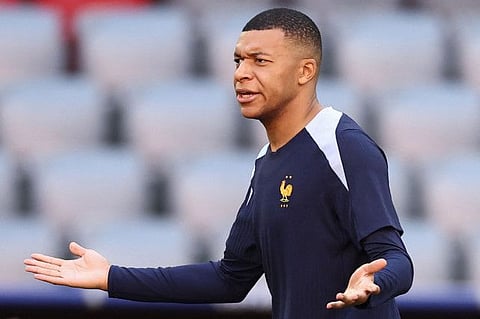 France's forward Kylian Mbappe reacts during a MD-1 training session at the Munich Football Arena in Munich, southern Germany, on Monday.