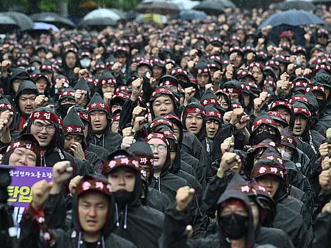 Members of the National Samsung Electronics Union stage a rally as they begin a three-day general strike outside the company's foundry and semiconductor factory in Hwaseong on July 8, 2024.
