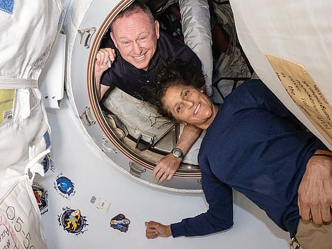 This undated handout picture from Nasa released on July2, 2024 shows NASA’s Boeing Crew Flight Test astronauts (from top) Butch Wilmore and Suni Williams inside the vestibule between the forward port on the International Space Station’s Harmony module and Boeing's Starliner spacecraft.