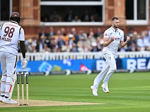 England's Gus Atkinson (right) celebrates after the dismissal of West Indies Jason Holder during play on the first day of the first Test cricket match at Lord's Cricket Ground in London on Wednesday.